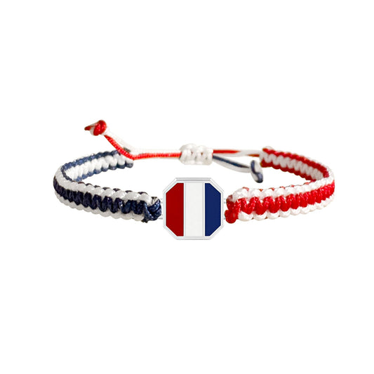 Braided Bracelet with red, navy and white fine metal charm in the middle.